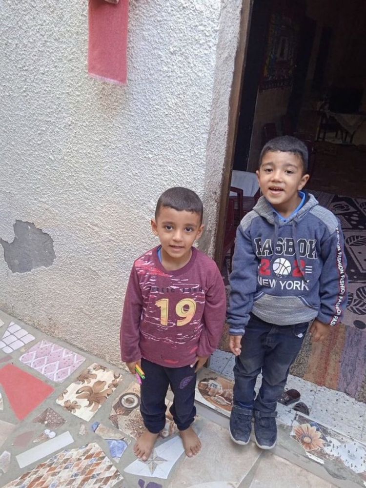 A picture of two young boys who were murdered by Israeli forces when they crossed an unmarked "yellow line" when looking for firewood.